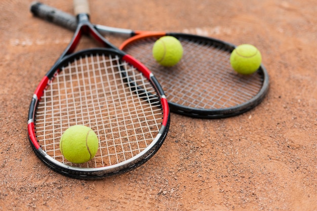 Free Photo | Tennis Rackets With Balls On The Court