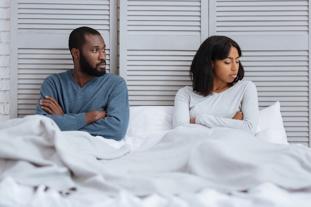 Premium Photo | Tense atmosphere. emotional young couple having a tense ...