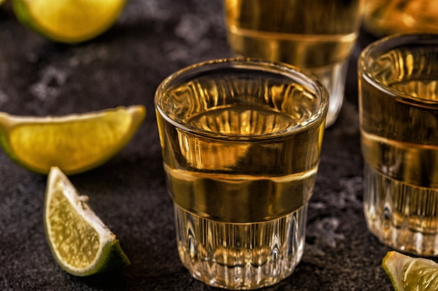 Premium Photo | Tequila in shot glasses with lime and salt