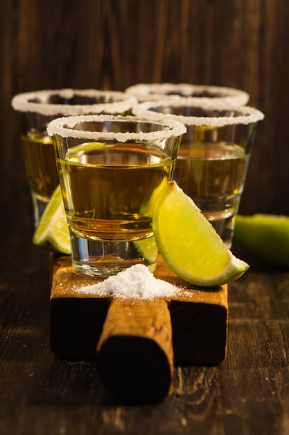 Premium Photo | Tequila shots, salt and lime slices
