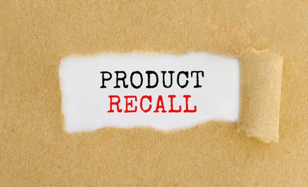 Premium Photo | Text product recall appearing behind ripped brown paper.