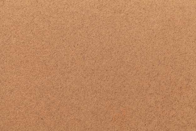古い薄茶色の紙のテクスチャ マットで密な段ボールの壁紙の構造 砂は背景を感じた プレミアム写真