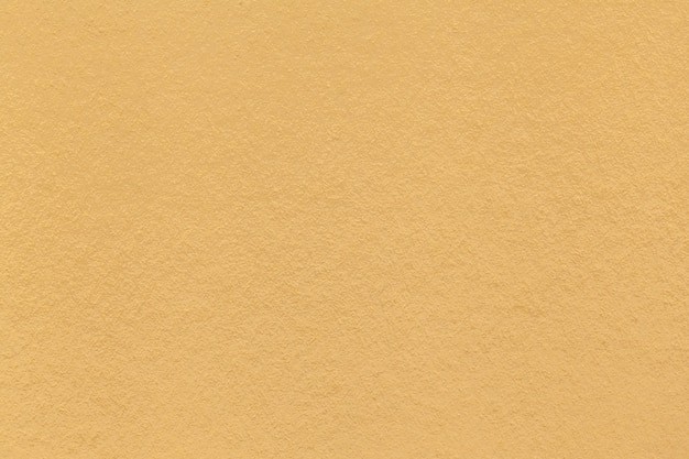 古い明るい黄色の紙のクローズアップのテクスチャ 高密度段ボールの構造 金色の背景 プレミアム写真