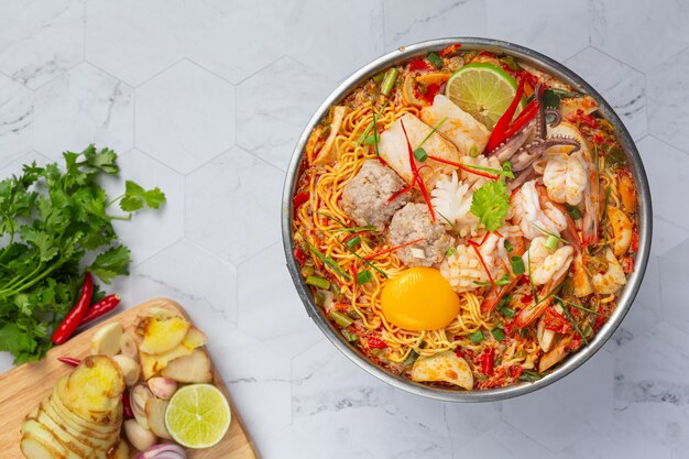 Free Photo | Thai food. noodles spicy boil with seafood and pork in hot pot