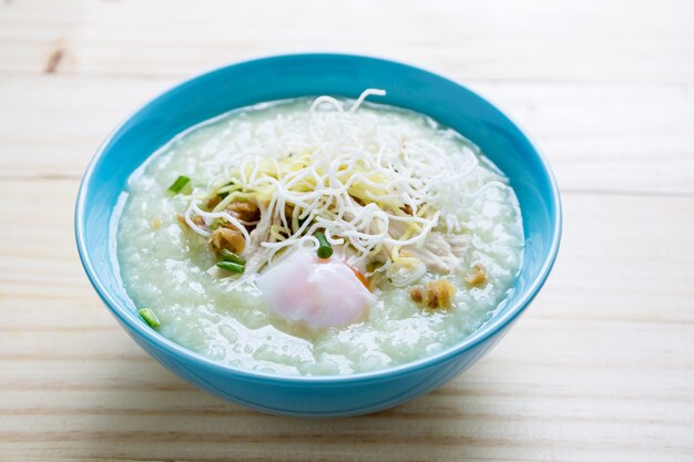 Premium Photo | Thai rice porridge with pork on wood table