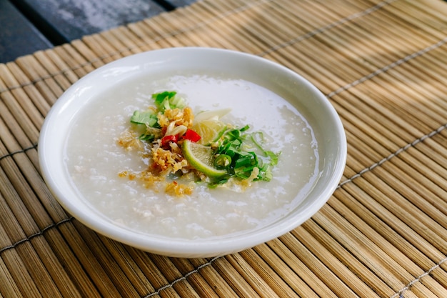 Premium Photo | Thai style rice congee or rice porridge with ingredient ...