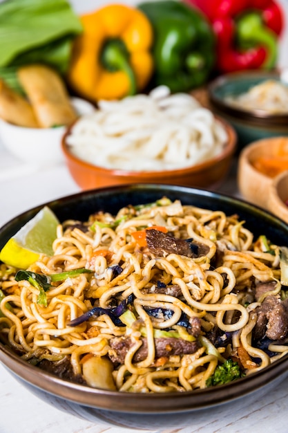 Free Photo | Thai udon noodles with beef and slice of lemon
