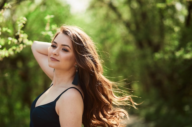 The beautiful girl stands in the park Free Photo