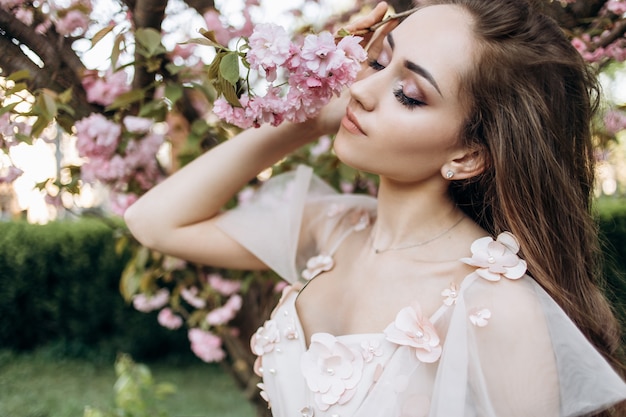 The charming bride stands in the park Free Photo