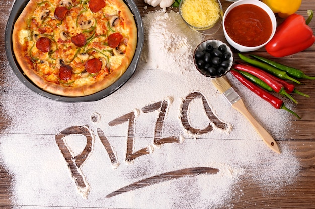 the-word-pizza-written-in-flour-photo-free-download