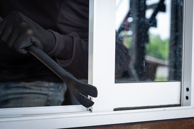 thieves wear black hats pry windows steal things 1150 15146