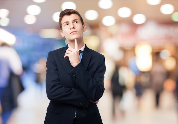 Thinking man with suit Free Photo