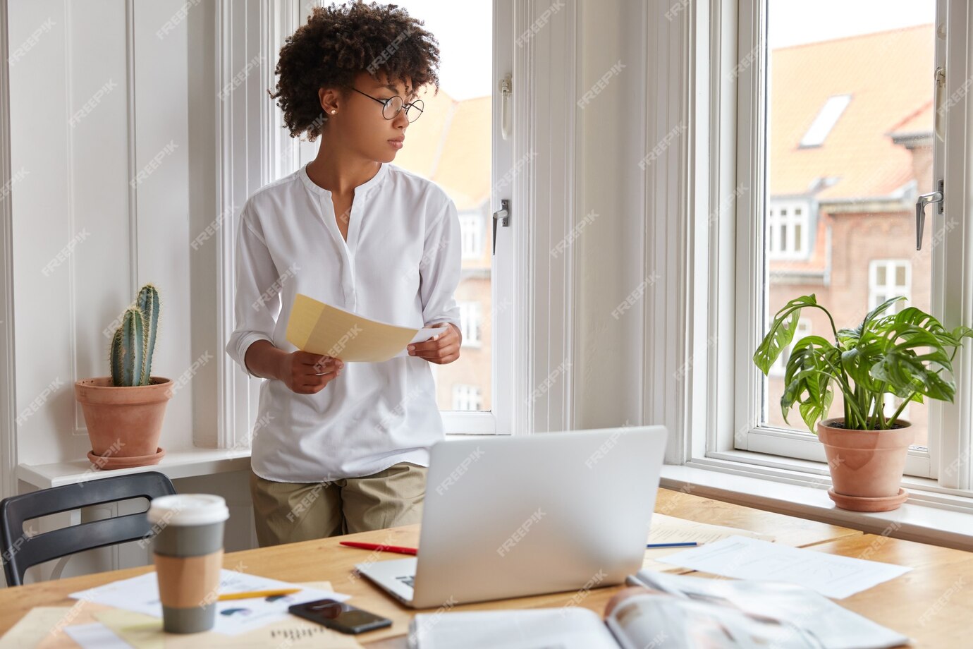 Free Photo | Thoughtful black young administrative worker prepares ...