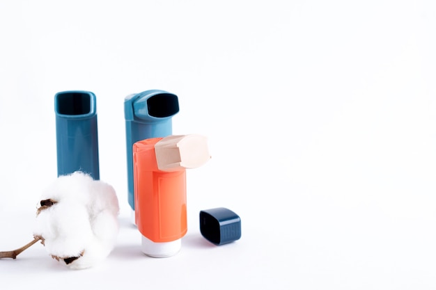 Premium Photo | Three asthma inhalers on an isolated white background ...