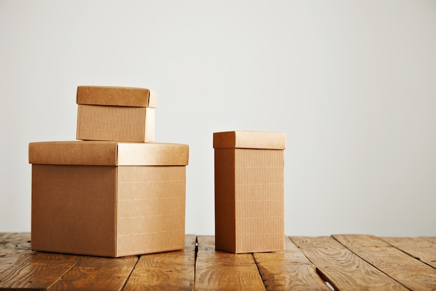 Free Photo | Three different sized beige cardboard boxes arranged on ...