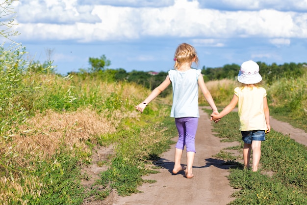 Premium Photo | Three girls walking at the outdoors