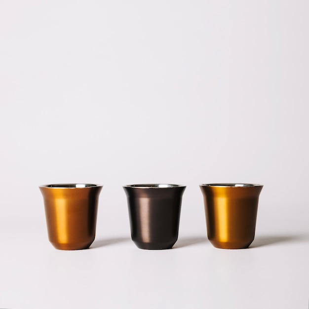 Free Photo | Three metallic coffee cup