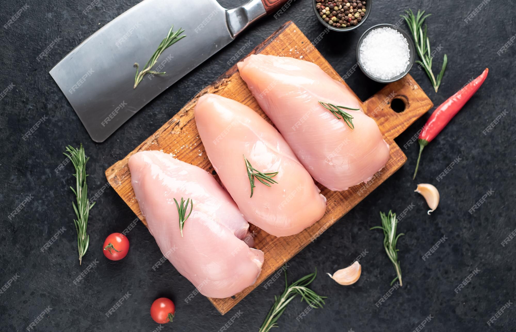 premium-photo-three-raw-chicken-breasts-on-stone-background