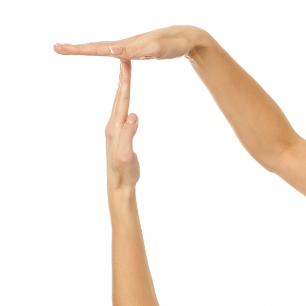 Premium Photo | Timeout. woman hand gesturing isolated on white