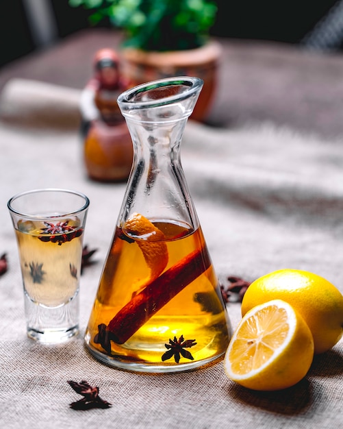 free-photo-tincture-with-anise-cinnamon-drink-lemon-peel-side-view