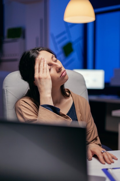 Premium Photo | Tired businesswoman keeping eyes closed rubbing ...