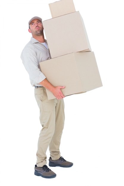 Premium Photo | Tired delivery man carrying stack boxes