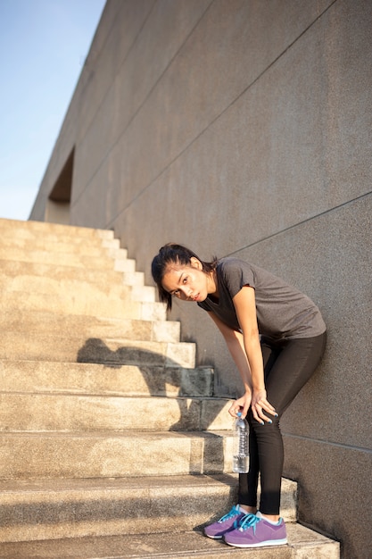 tired-girl-resting-on-the-stairs-photo-free-download