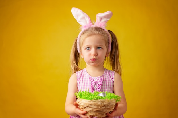 Premium Photo | Toddler blonde happy girl with bunny ears and basket of ...