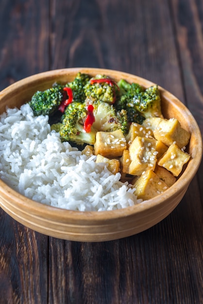 Premium Photo | Tofu and broccoli stir-fry with white rice