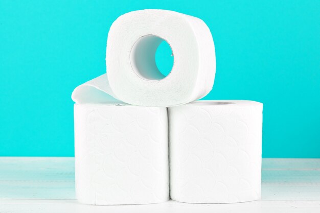 Toilet paper rolls on turquoise bright Premium Photo