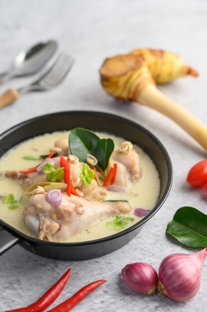 Free Photo | Tom kha kai in a pan frying with kaffir lime leaves ...