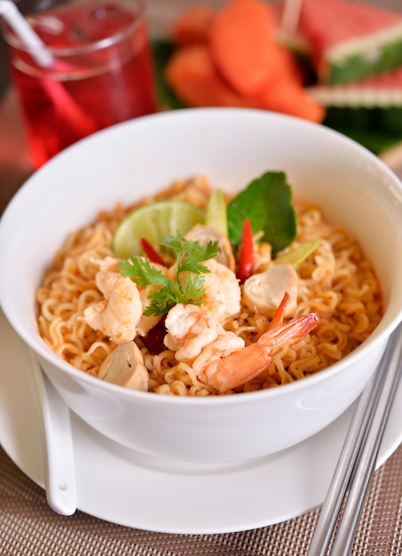 Premium Photo | Tom yum kung with noodles, thai food