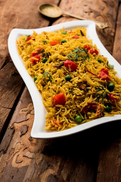 Premium Photo | Tomato rice also known as tamatar pilaf or pulav made ...