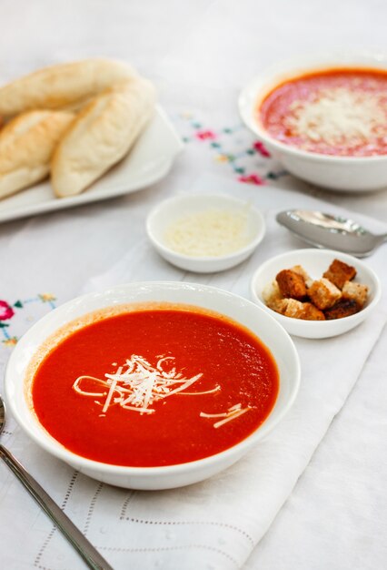 Free Photo | Tomato soup with crackers and grated cheese