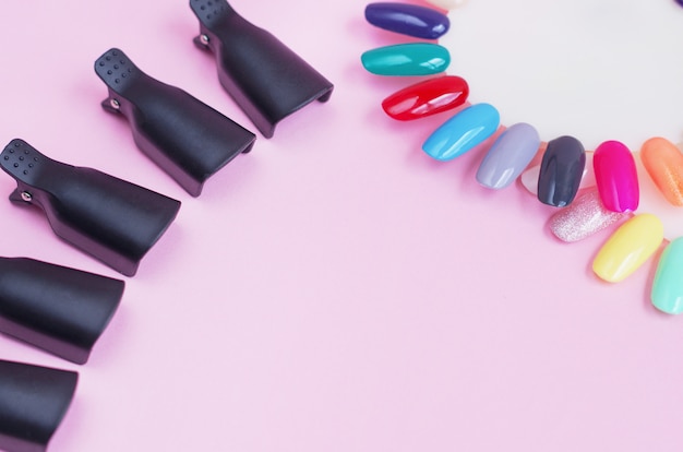 Premium Photo | Tools for manicure on a pink background