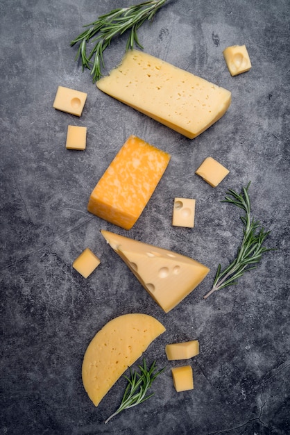 Free Photo | Top view assortment of tasty cheese on the table