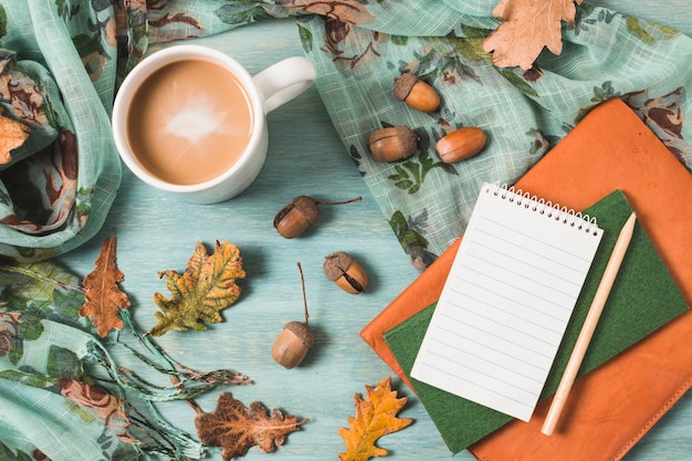Top view autumn composition with coffee and notebooks Free Photo