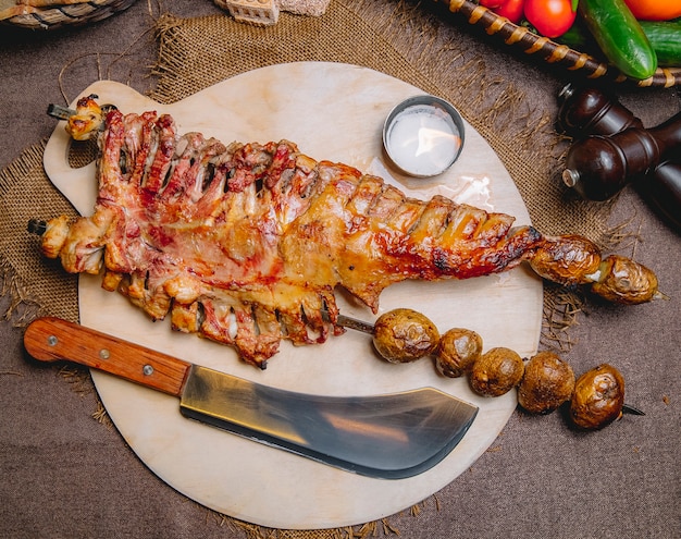 Free Photo | Top view baked lamb ribs in the oven on skewers with