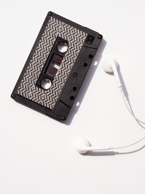 Premium Photo Top View Black Cassette Tape With Earphones