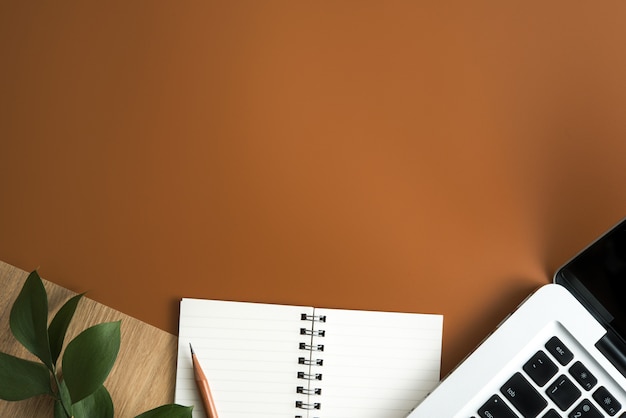 Top view of brown office desk table with copy space. flat lay. Premium Photo