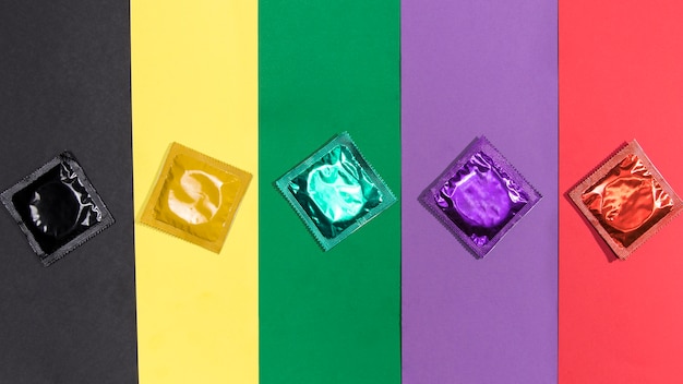 Top view condoms on same colour background Free Photo