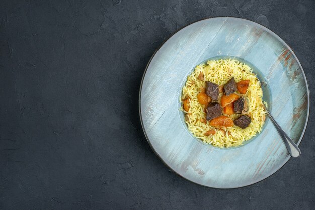 Free Photo Top View Delicious Pilaf Cooked Rice With Dried Apricots