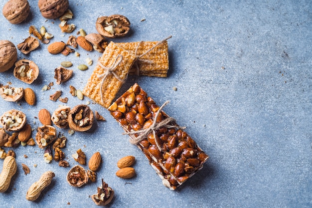 Top View Of Dried Fruits Energy Bars On Concrete Background Free