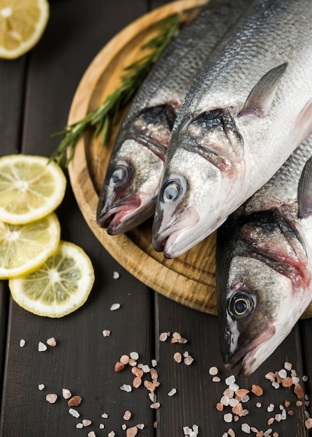 Free Photo | Top view fish with lemon and salt