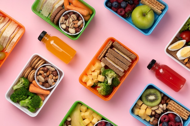 Free Photo | Top view food lunch boxes assortment