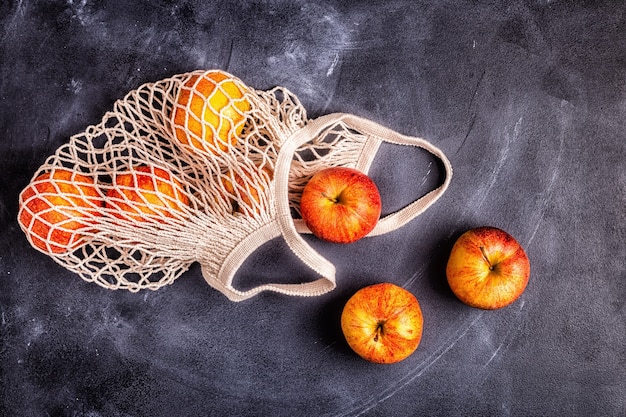 Premium Photo | Top view on fresh apples in a mesh bag