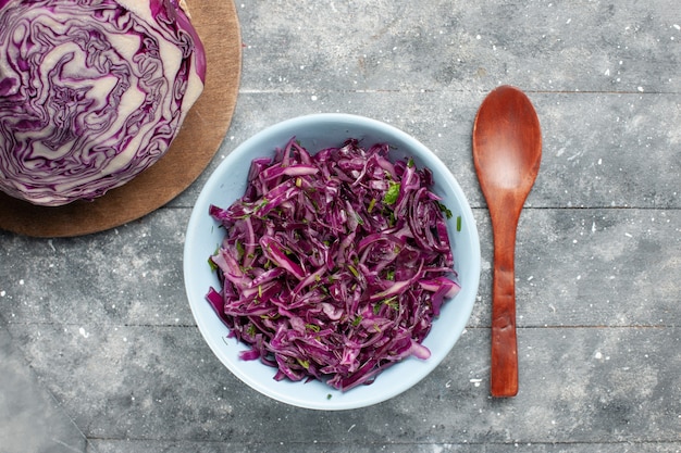 Top view fresh sliced cabbage purple cabbage whole and sliced on the grey desk vegetable salad fresh ripe Free Photo