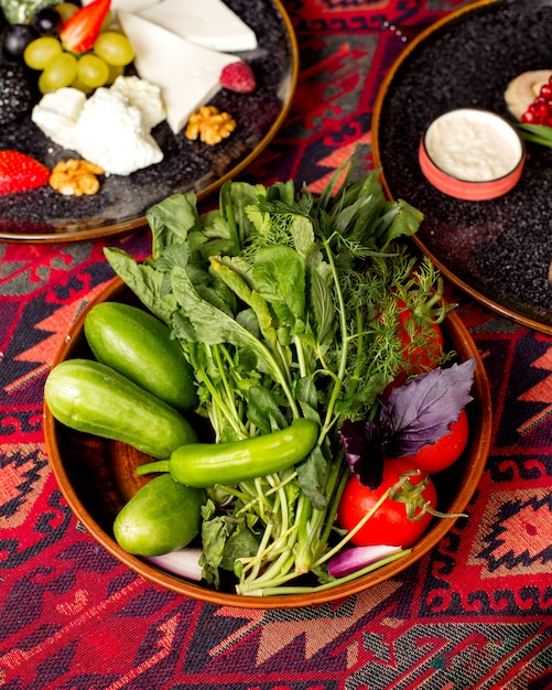 Free Photo | Top view of greens plate with cucumber, tomato, cockweed ...