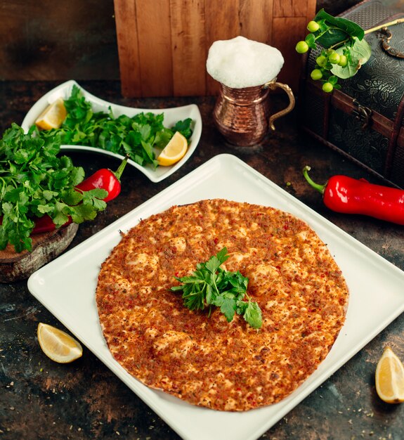 Free Photo | Top view of lahmacun turkish pizza served with parsley ...