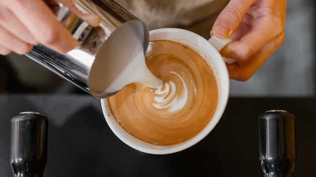 [Image: top-view-male-barista-pouring-milk-coffe...824443.jpg]